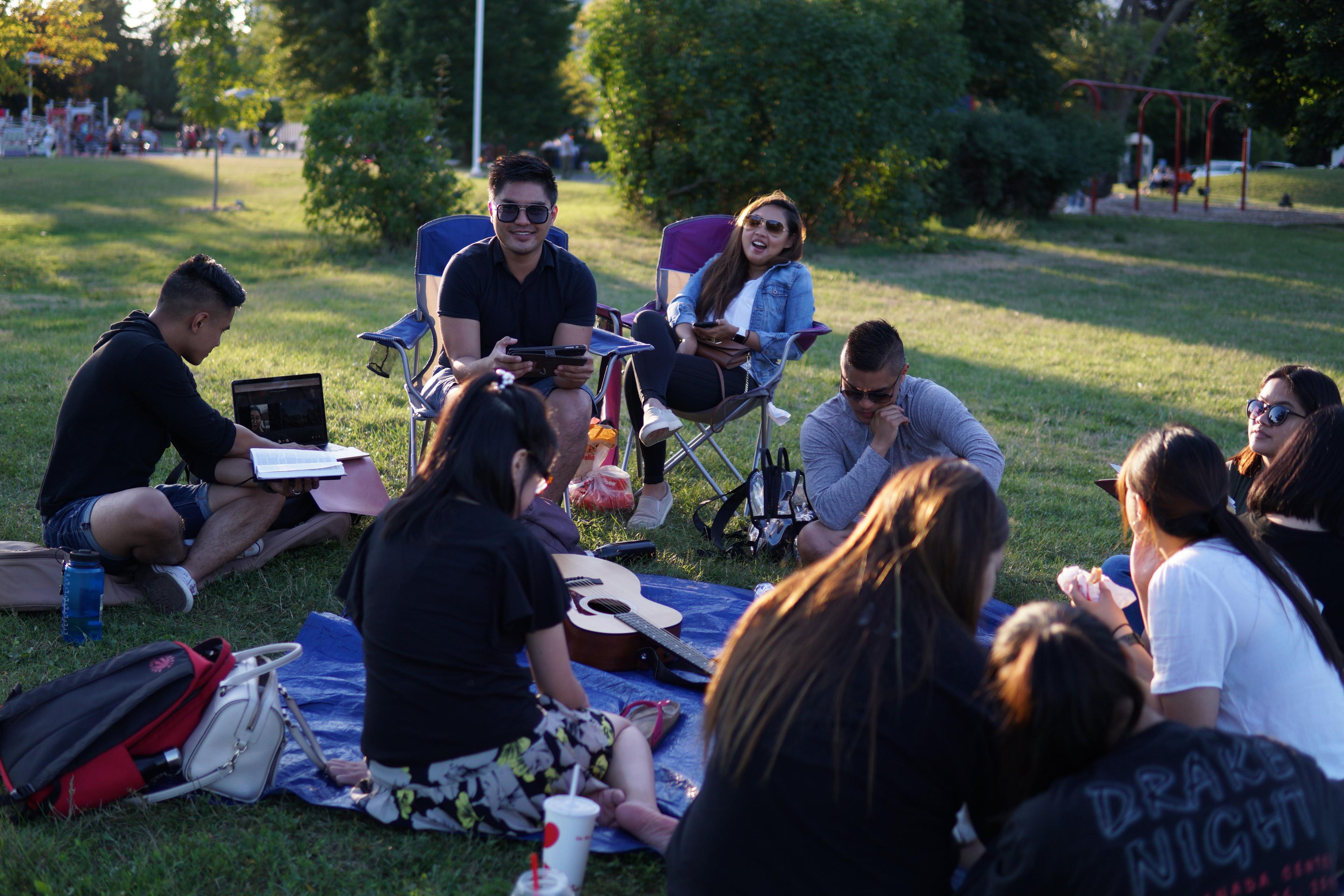 Youth & Young Adults having outdoor bible study